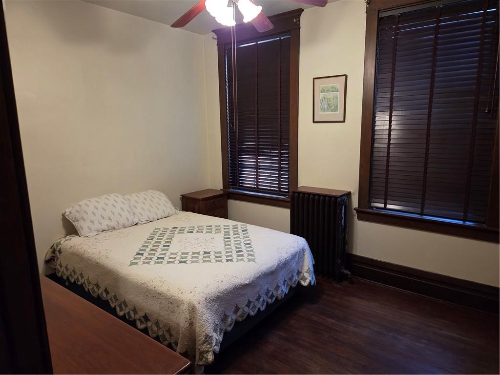 701 4th Street, Unit 2 Pittsburgh, PA 15215 - Photo 15 of 24 a bed sitting in a bedroom next to a window