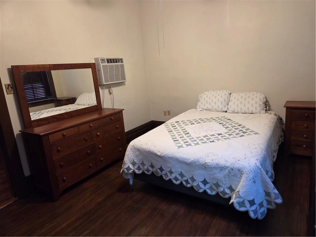 701 4th Street, Unit 2 Pittsburgh, PA 15215 - Photo 16 of 24 a bedroom with a bed and a dresser