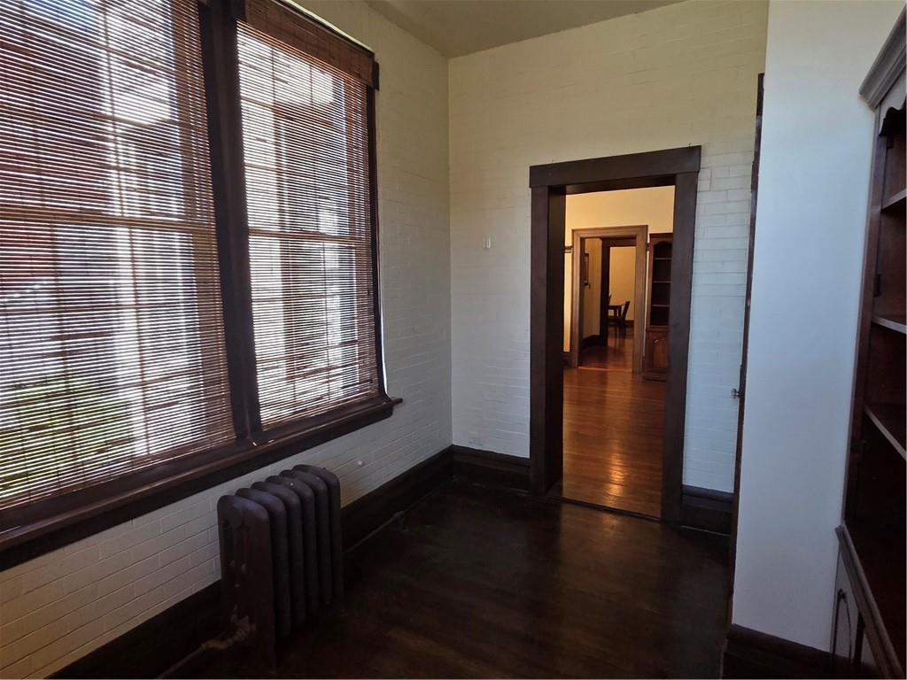 701 4th Street, Unit 2 Pittsburgh, PA 15215 - Photo 18 of 24 a view of a hallway with wooden floor and a window