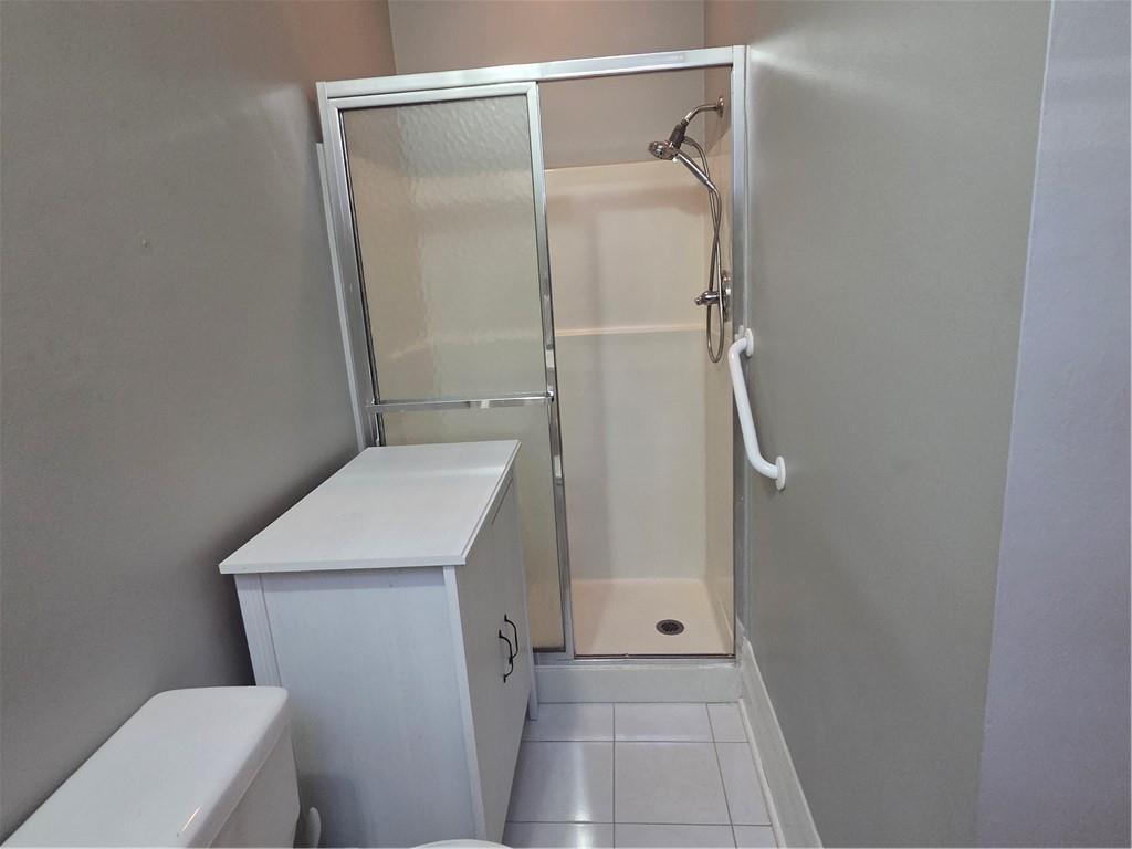701 4th Street, Unit 2 Pittsburgh, PA 15215 - Photo 20 of 24 a bathroom with a granite countertop sink toilet and shower