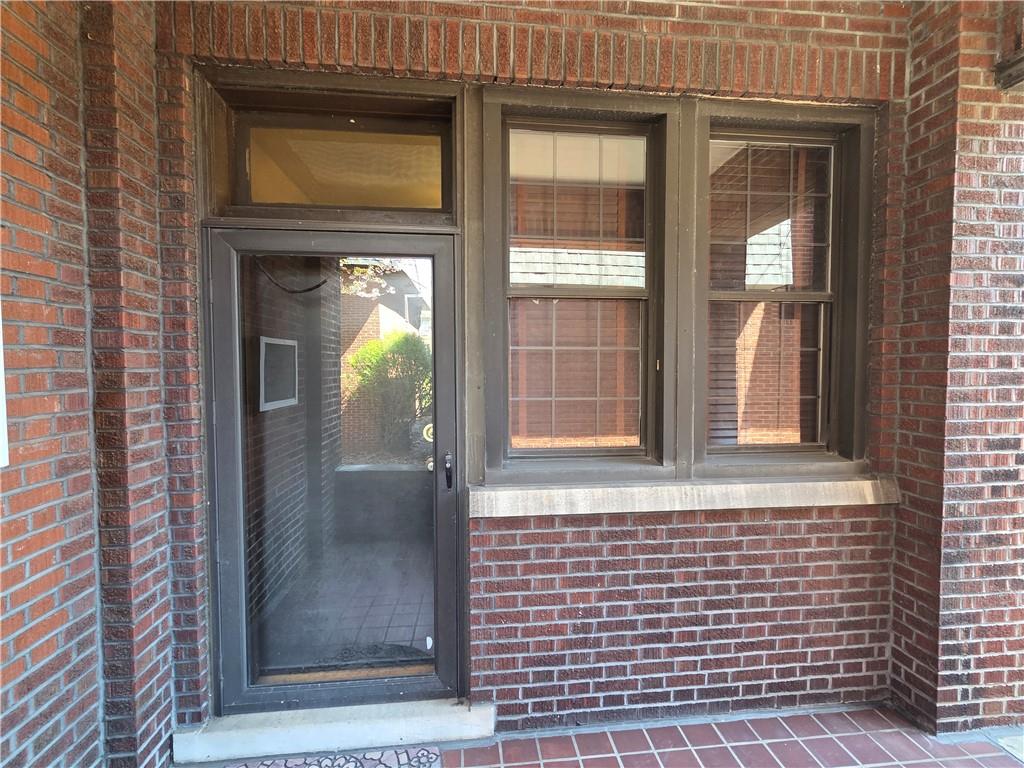701 4th Street, Unit 2 Pittsburgh, PA 15215 - Photo 22 of 24 a front view of a house with a glass door