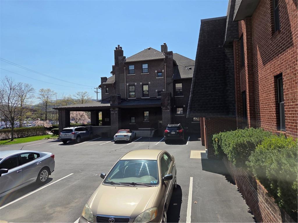 701 4th Street, Unit 2 Pittsburgh, PA 15215 - Photo 3 of 24 a view of a car park in front of a building