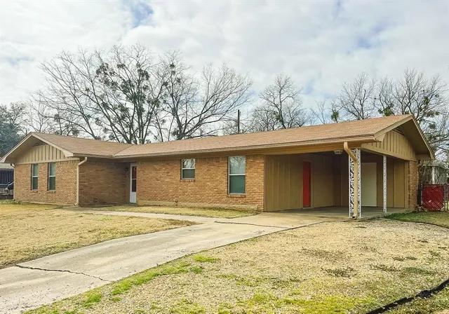 a house with trees in the background