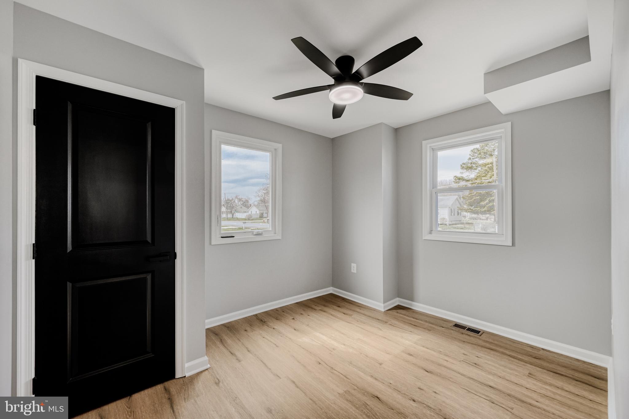 39 Transverse Avenue Middle River, MD 21220 - Photo 13 of 29 a view of a big room with wooden floor and windows