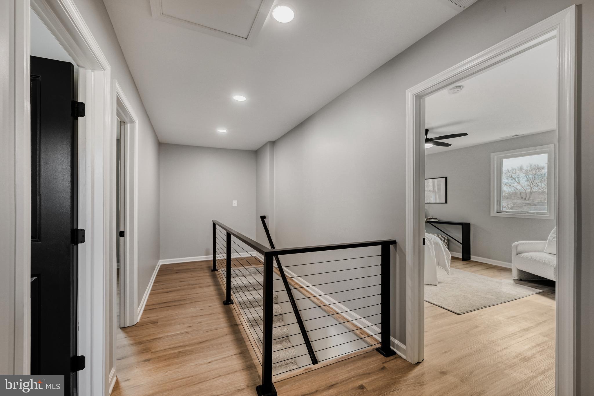 39 Transverse Avenue Middle River, MD 21220 - Photo 16 of 29 a view of a hallway view with wooden floor and staircase