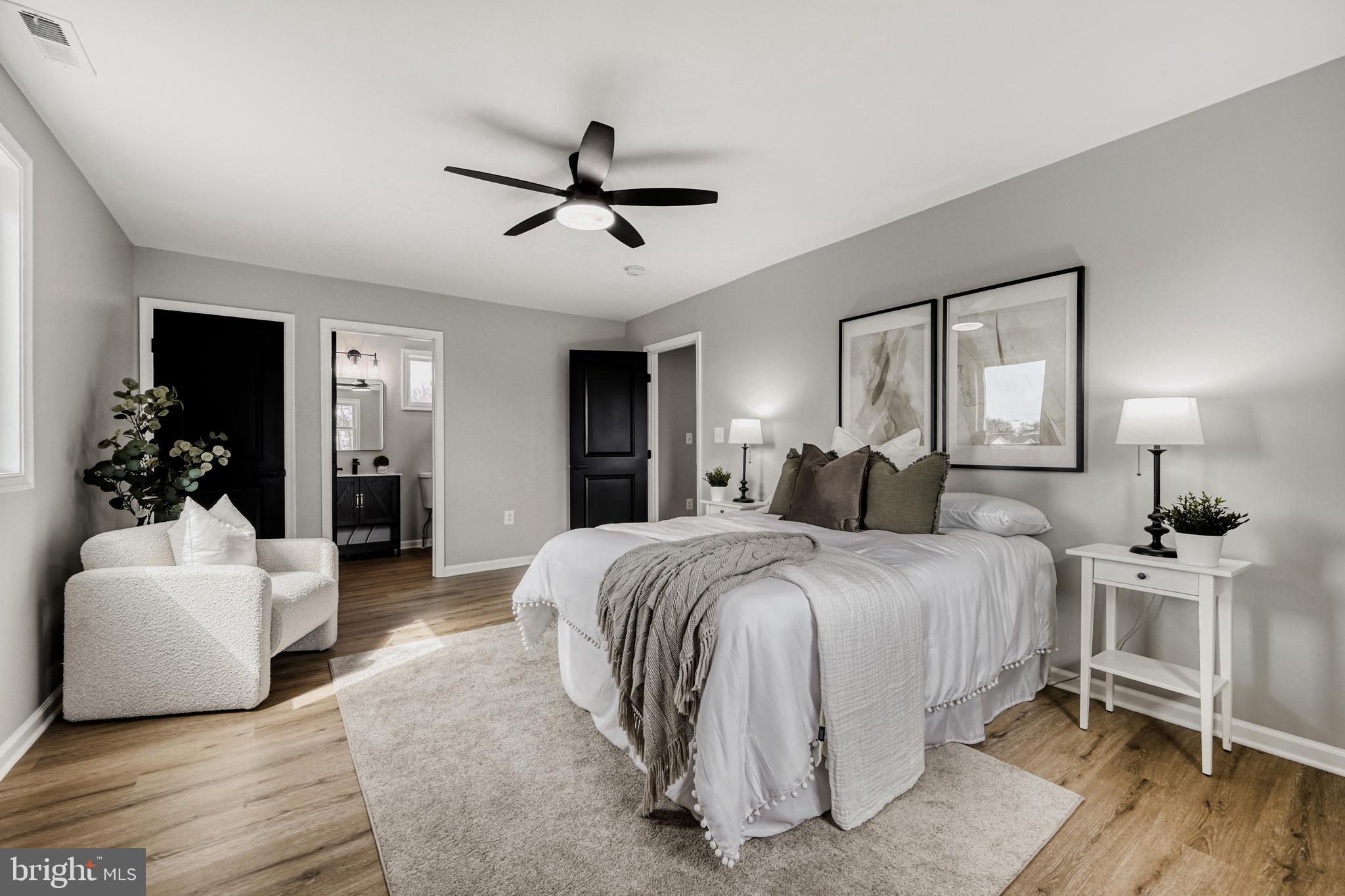 39 Transverse Avenue Middle River, MD 21220 - Photo 18 of 29 a spacious bedroom with a bed and a couch