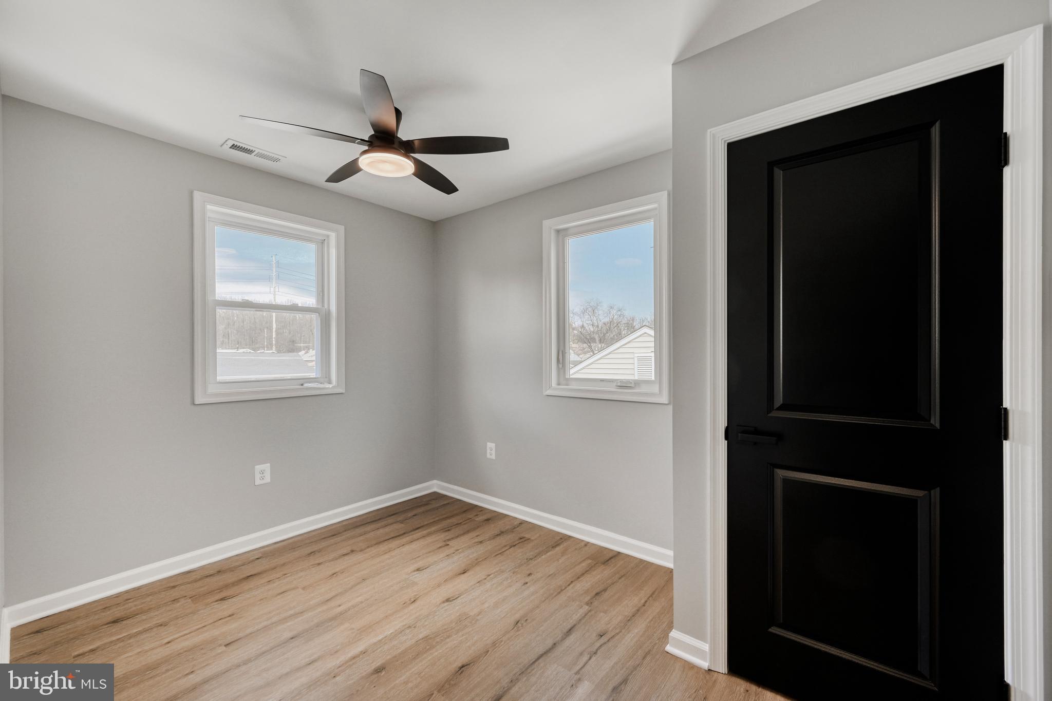 39 Transverse Avenue Middle River, MD 21220 - Photo 20 of 29 a view of empty room with wooden floor and fan