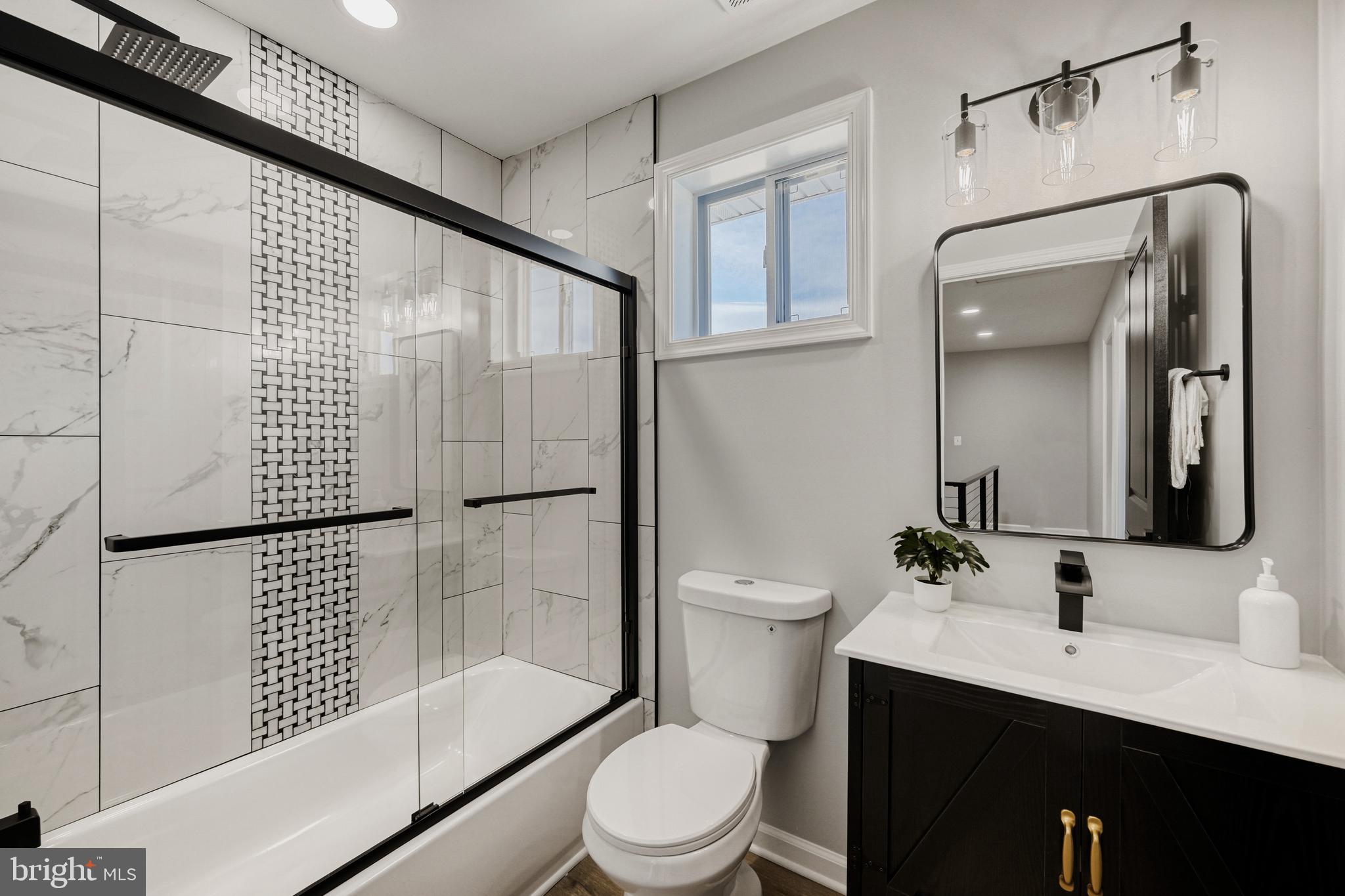 39 Transverse Avenue Middle River, MD 21220 - Photo 21 of 29 a bathroom with a sink toilet and shower