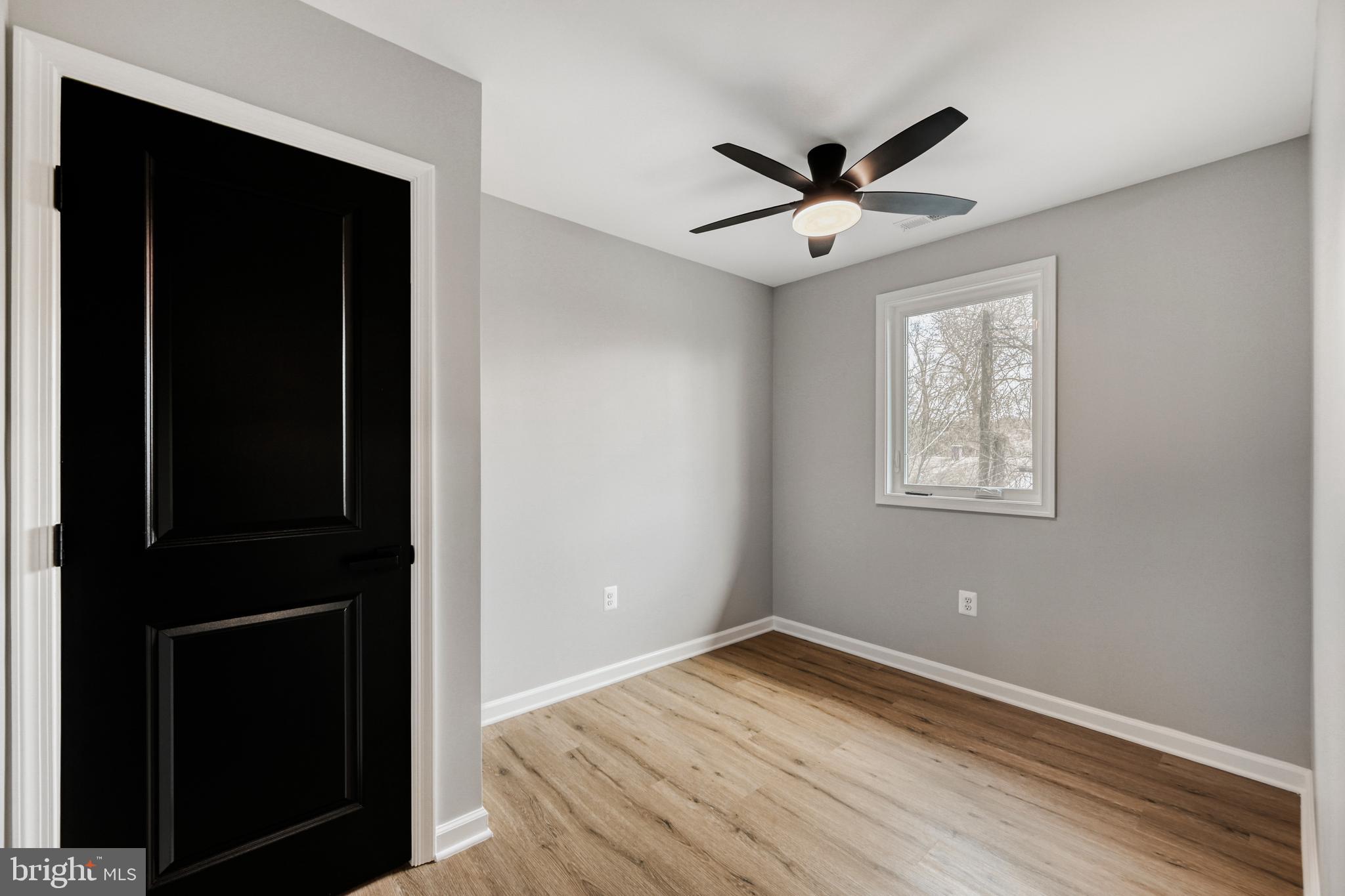 39 Transverse Avenue Middle River, MD 21220 - Photo 22 of 29 a view of empty room with wooden floor and fan