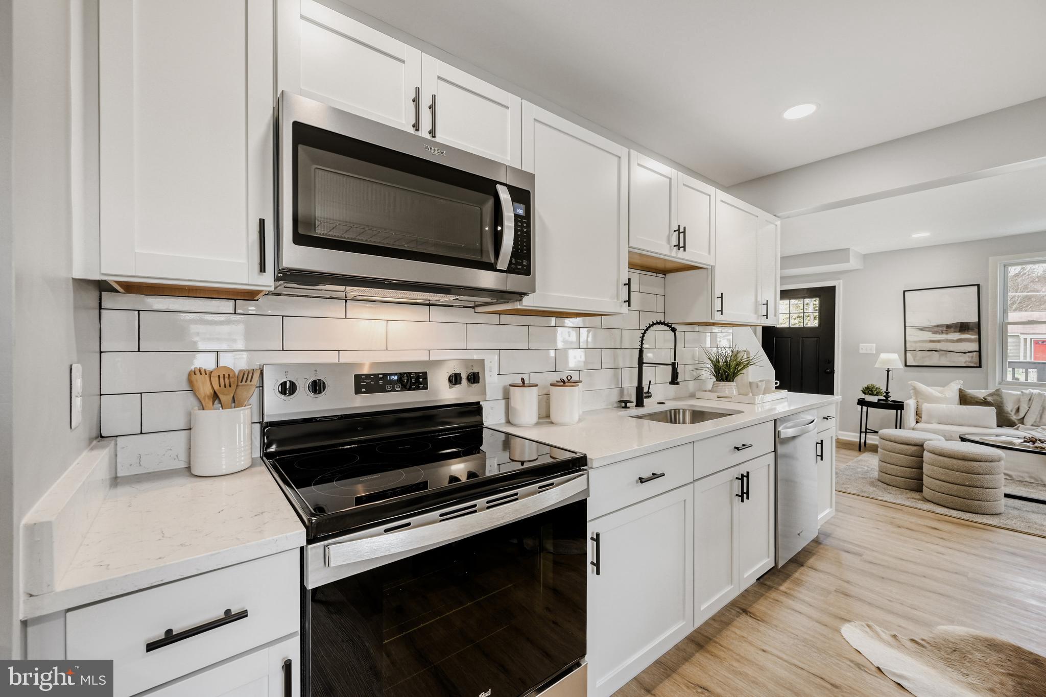 39 Transverse Avenue Middle River, MD 21220 - Photo 10 of 29 a kitchen with a stove and a microwave