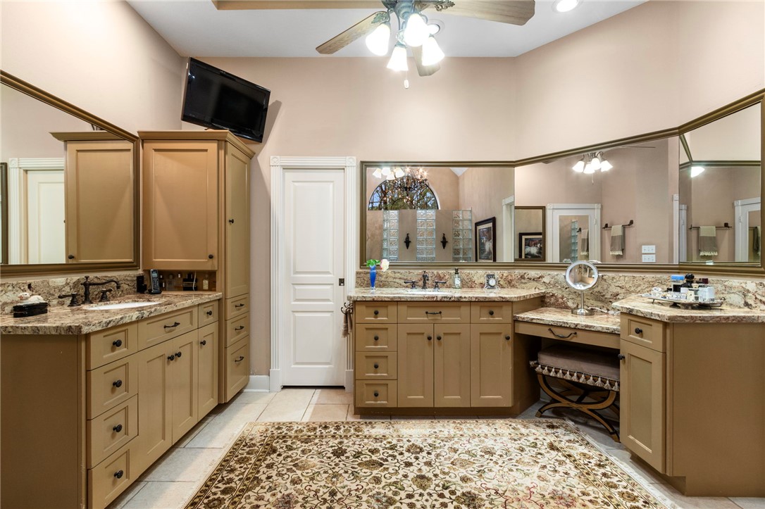 322 Whispering Meadow Magnolia, TX 77355 - Photo 11 of 34 a kitchen with a sink and stove
