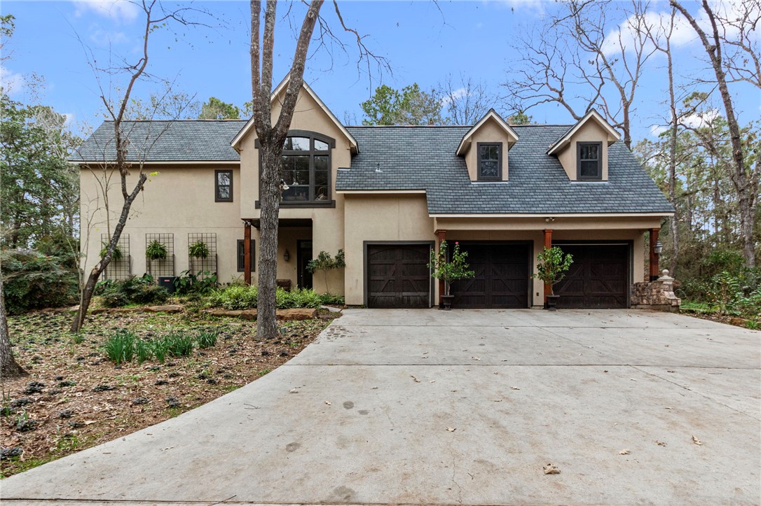 322 Whispering Meadow Magnolia, TX 77355 - Photo 3 of 34 a front view of a house with yard and parking