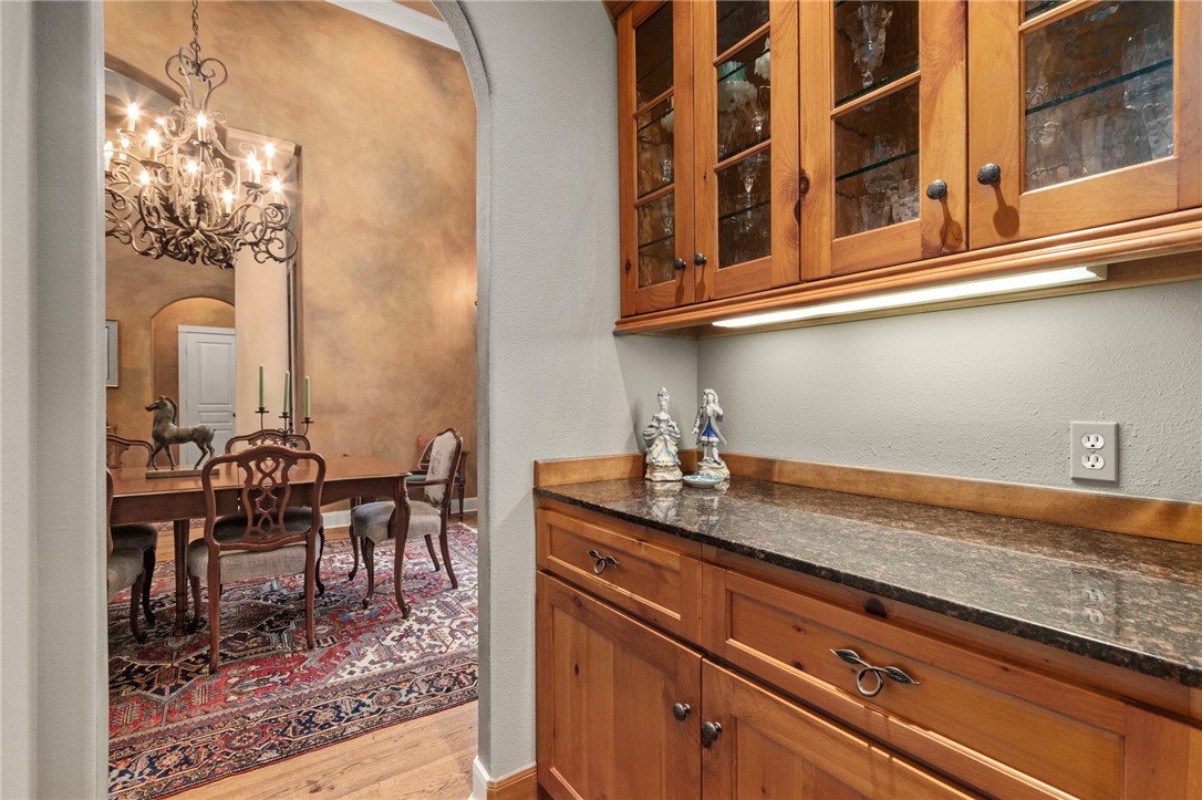 322 Whispering Meadow Magnolia, TX 77355 - Photo 7 of 34 a kitchen with stainless steel appliances granite countertop a sink and cabinets