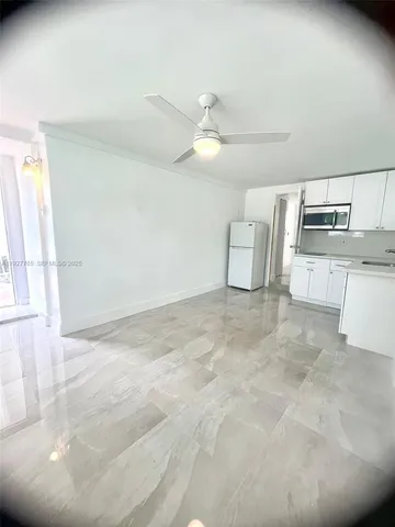 a view of a kitchen with wooden cabinet and a fireplace