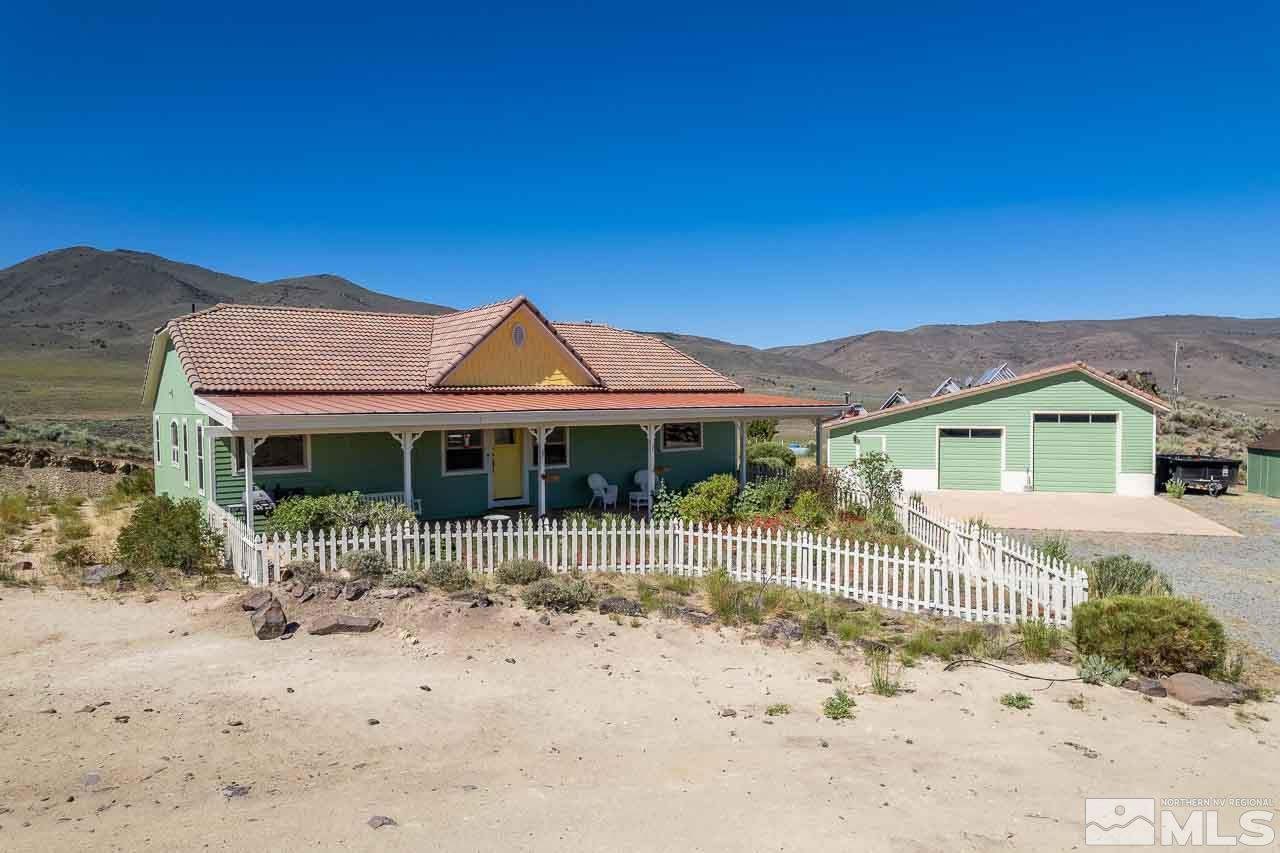 3415 Basque Oven Road Reno, NV 89510 - Photo 3 of 32 a front view of a house with a yard