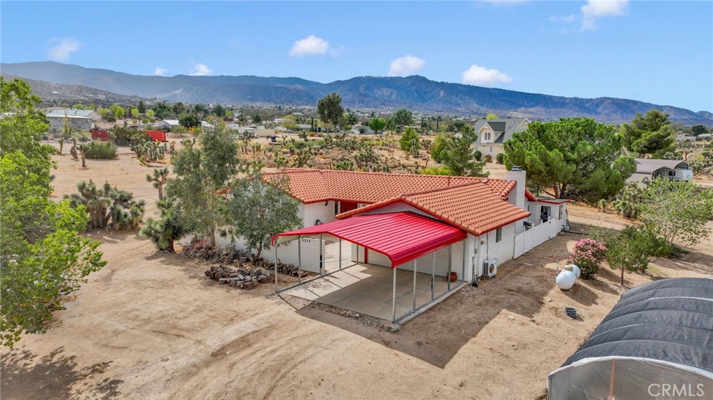 9224 Beekley Road Phelan, CA 92371 - Photo 1 of 52 a view of a terrace with a table and chairs