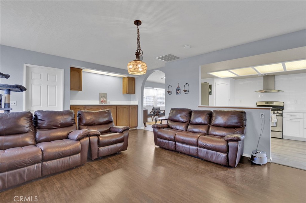 9224 Beekley Road Phelan, CA 92371 - Photo 15 of 52 a living room with furniture and a wooden floor