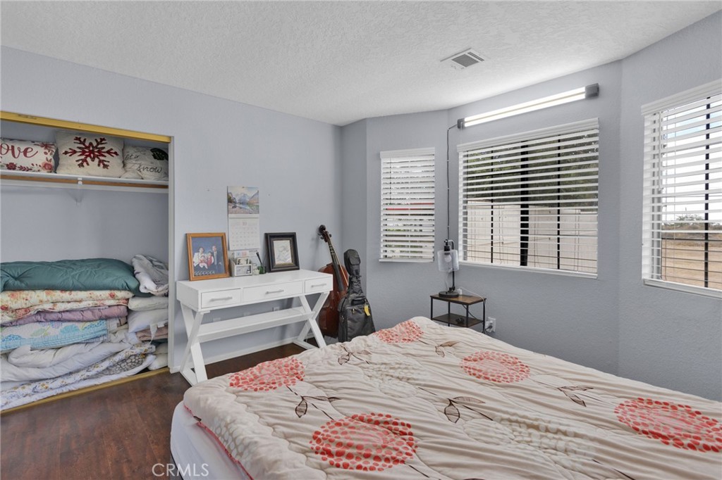 9224 Beekley Road Phelan, CA 92371 - Photo 18 of 52 a bedroom with a bed and a window