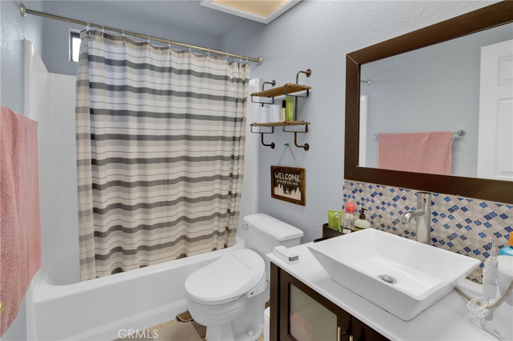 9224 Beekley Road Phelan, CA 92371 - Photo 19 of 52 a bathroom with a sink toilet and shower