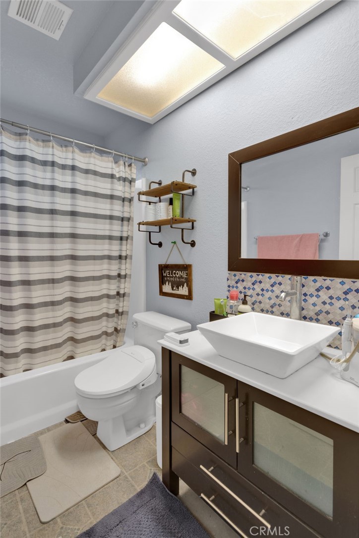 9224 Beekley Road Phelan, CA 92371 - Photo 20 of 52 a bathroom with a sink toilet and shower