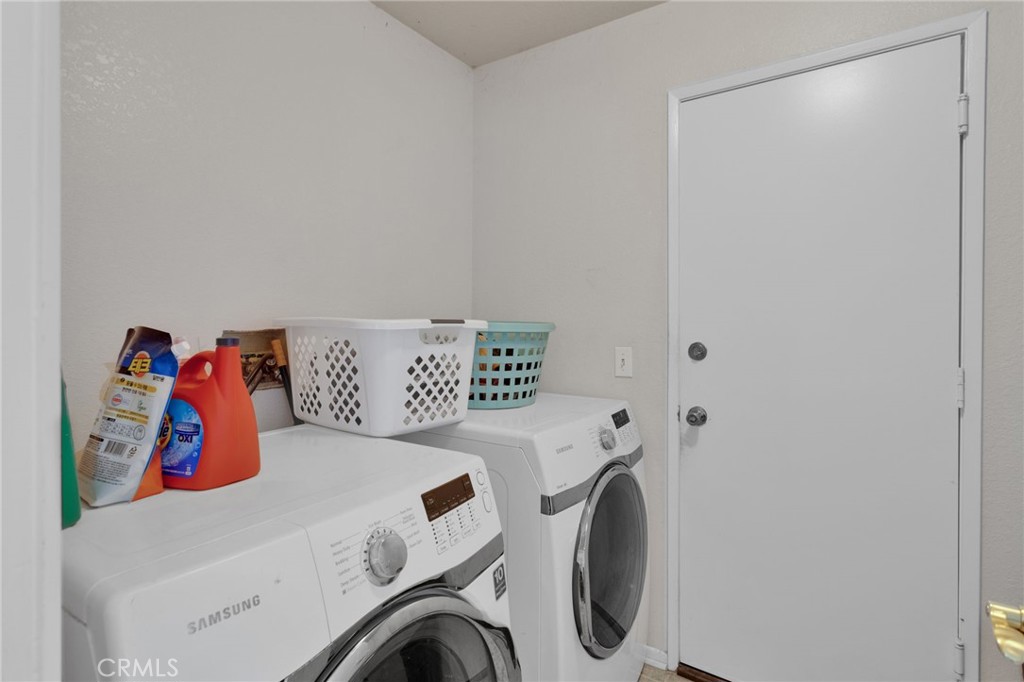 9224 Beekley Road Phelan, CA 92371 - Photo 29 of 52 a utility room with dryer and washer