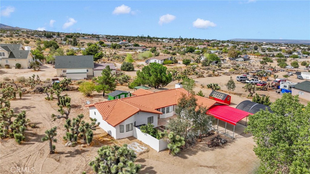 9224 Beekley Road Phelan, CA 92371 - Photo 46 of 52 an aerial view of a city with lots of residential buildings ocean and mountain view in back