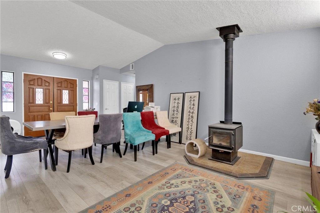 9224 Beekley Road Phelan, CA 92371 - Photo 5 of 52 a living room with furniture a rug and a fireplace