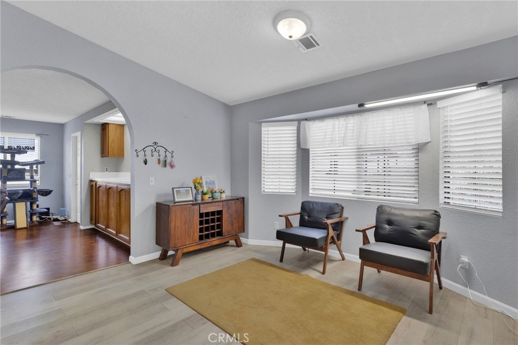 9224 Beekley Road Phelan, CA 92371 - Photo 8 of 52 a living room with furniture and a wooden floor