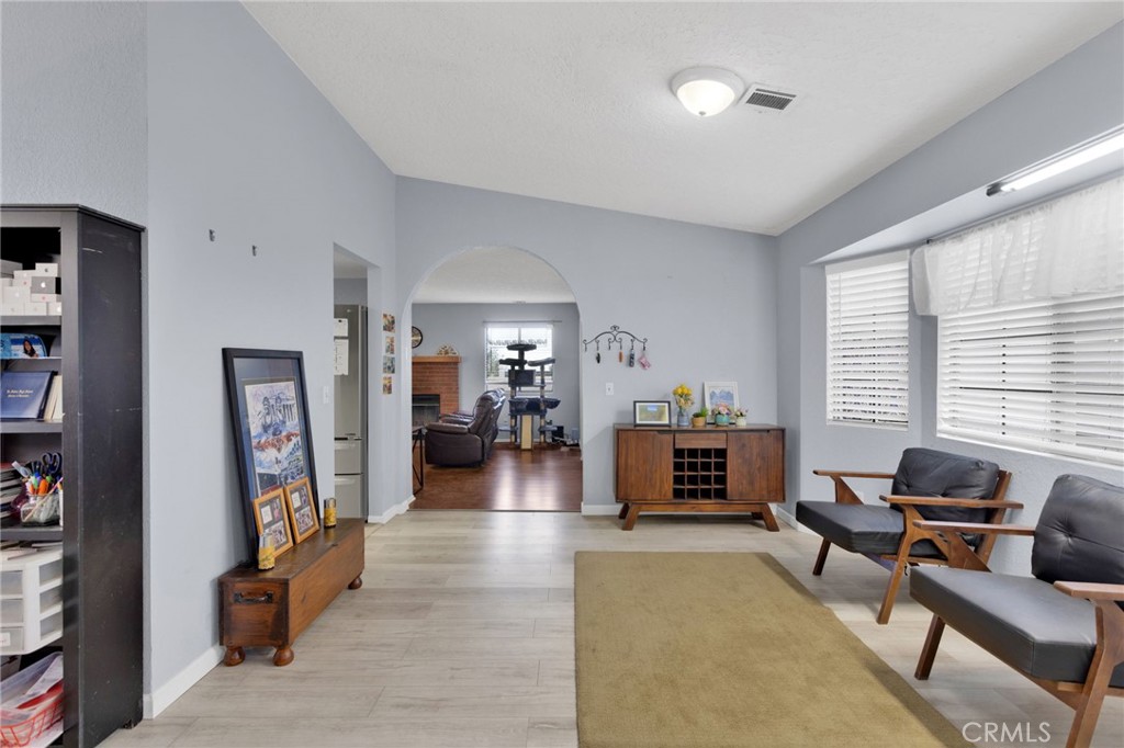 9224 Beekley Road Phelan, CA 92371 - Photo 9 of 52 a living room with furniture and a fireplace