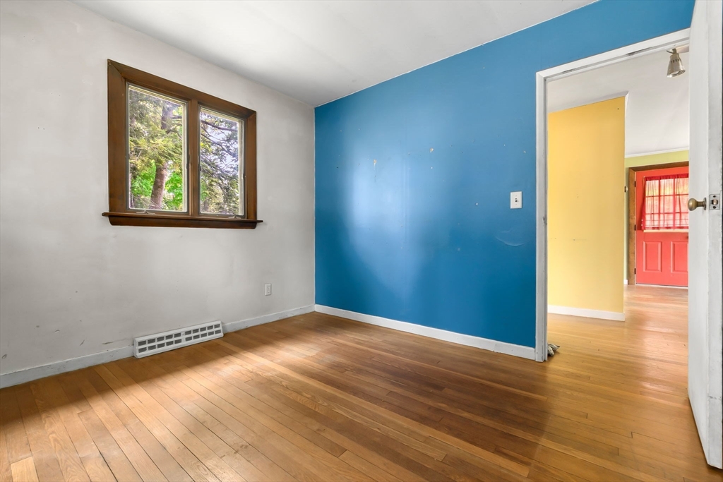 71 Union Street Hamilton, MA 01982 - Photo 13 of 21 a view of an empty room with window and wooden floor