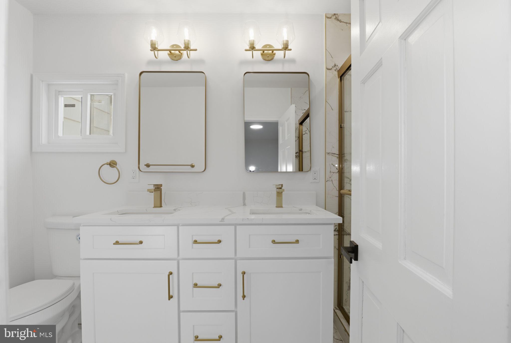 311 Ellsworth Drive Silver Spring, MD 20910 - Photo 31 of 65 a bathroom with a double vanity sink mirror and