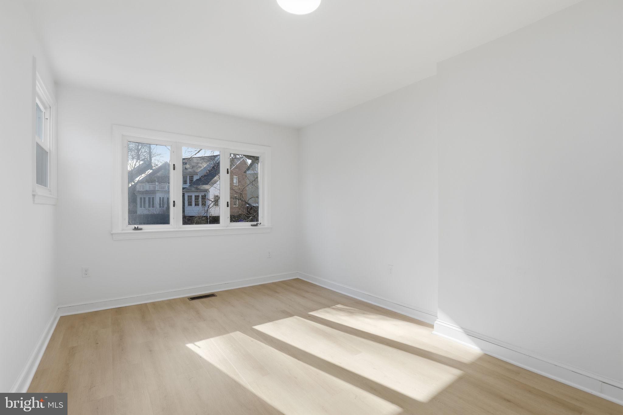 311 Ellsworth Drive Silver Spring, MD 20910 - Photo 35 of 65 a view of an empty room with a window