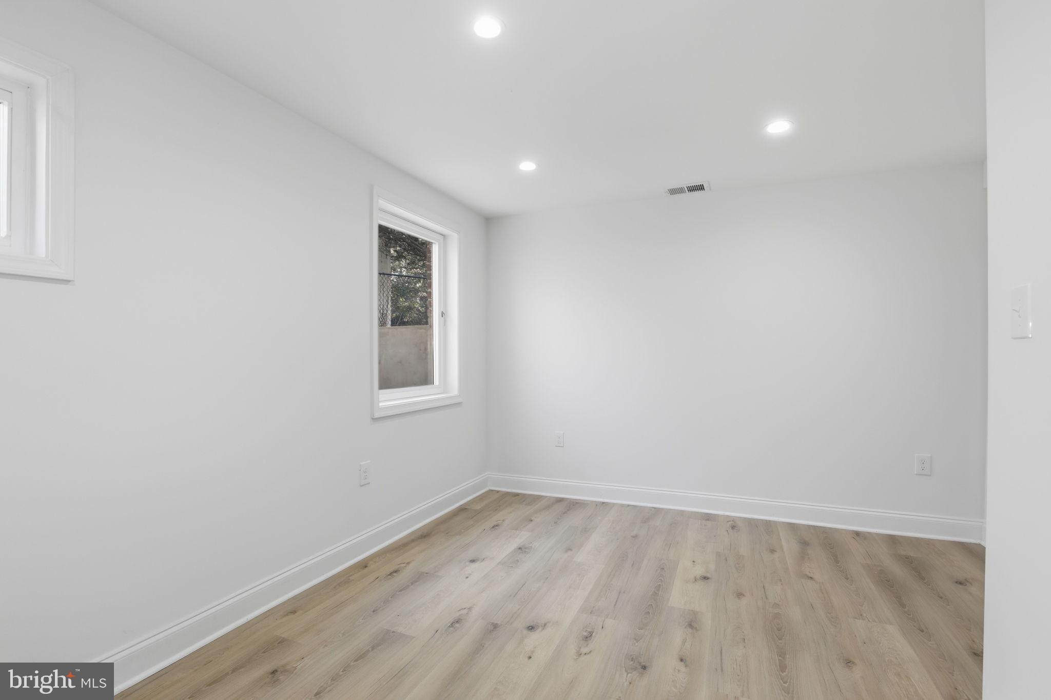 311 Ellsworth Drive Silver Spring, MD 20910 - Photo 48 of 65 a view of a room with wooden floor and window