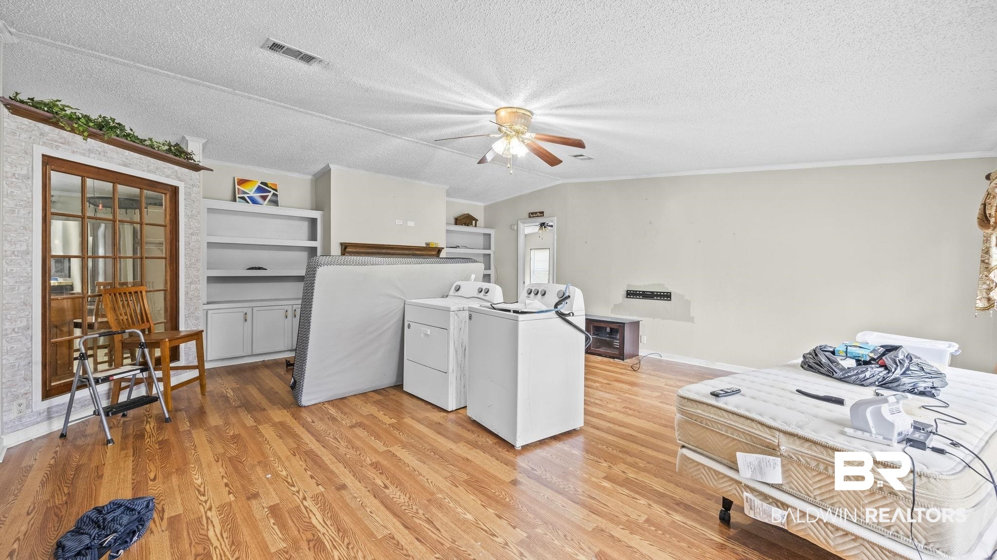 34985b Spring Road South, Unit B Stapleton, AL 36578 - Photo 19 of 31 Expansive interior space featuring wood-finish flooring, a ceiling fan, and recessed lighting