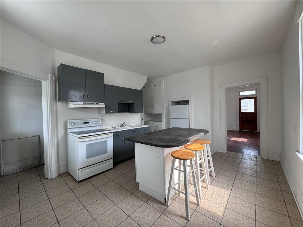 441 5th Street Donora, PA 15033 - Photo 13 of 16 a kitchen with stainless steel appliances granite countertop a stove and a sink