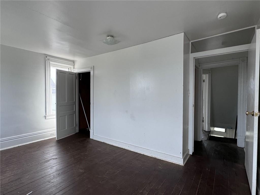441 5th Street Donora, PA 15033 - Photo 6 of 16 an empty room with wooden floor and a window