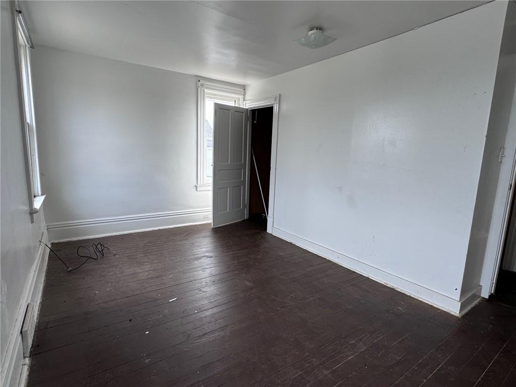 441 5th Street Donora, PA 15033 - Photo 7 of 16 an empty room with wooden floor and natural light