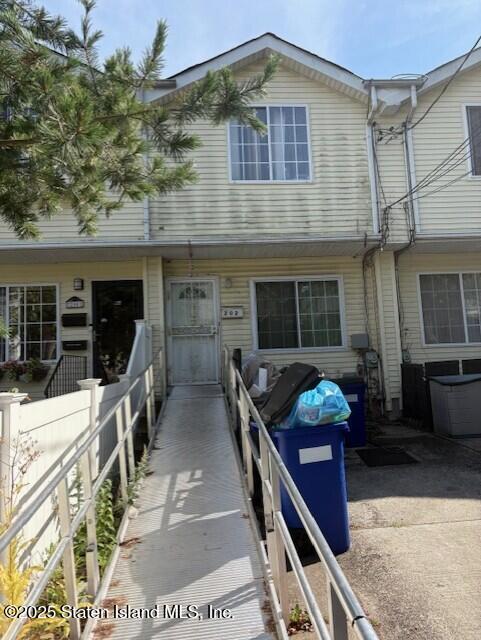 202 Chestnut Avenue Staten Island, NY 10305 - Photo 1 of 24 a front view of a house with patio