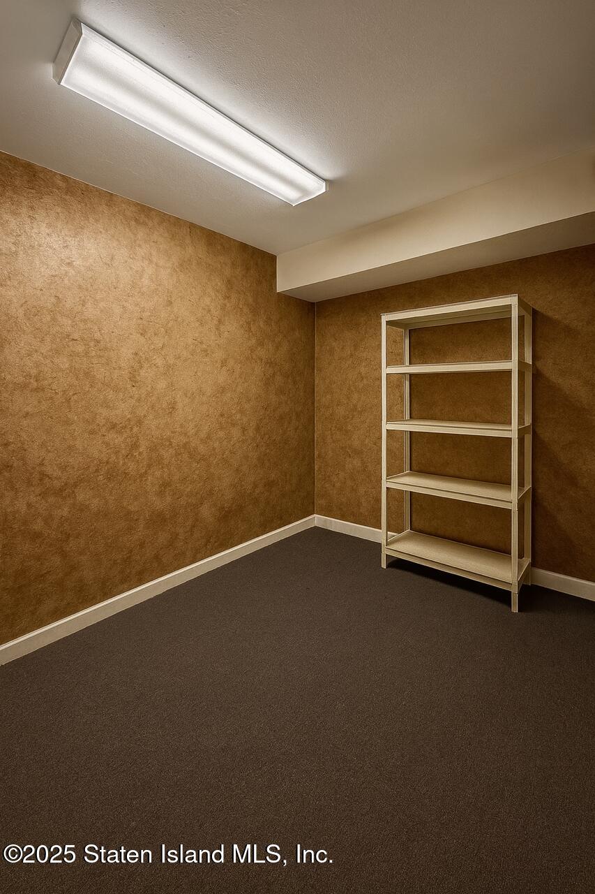 202 Chestnut Avenue Staten Island, NY 10305 - Photo 8 of 24 a view of an empty room with a window