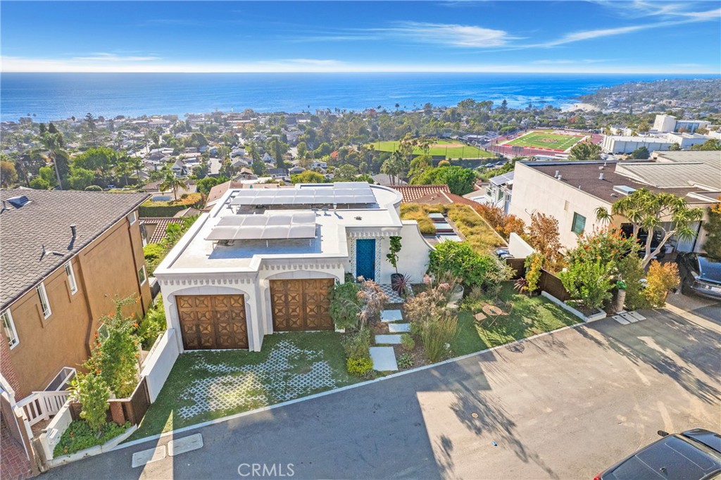 825 Coast View Drive Laguna Beach, CA 92651 - Photo 1 of 63 an aerial view of a house with a yard