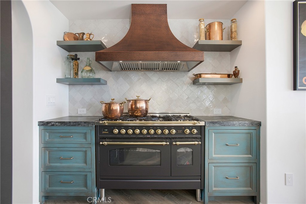 825 Coast View Drive Laguna Beach, CA 92651 - Photo 14 of 63 a stove top oven sitting inside of a kitchen