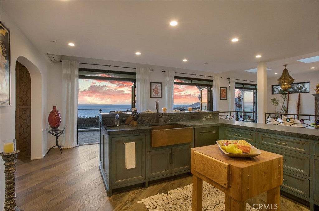 825 Coast View Drive Laguna Beach, CA 92651 - Photo 18 of 63 a kitchen with stainless steel appliances granite countertop a stove and a refrigerator