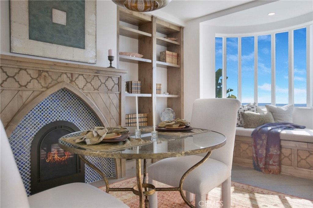 825 Coast View Drive Laguna Beach, CA 92651 - Photo 19 of 63 a living room with furniture and a fireplace