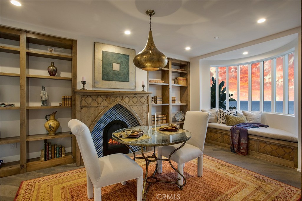 825 Coast View Drive Laguna Beach, CA 92651 - Photo 20 of 63 a living room with furniture fireplace and a large window