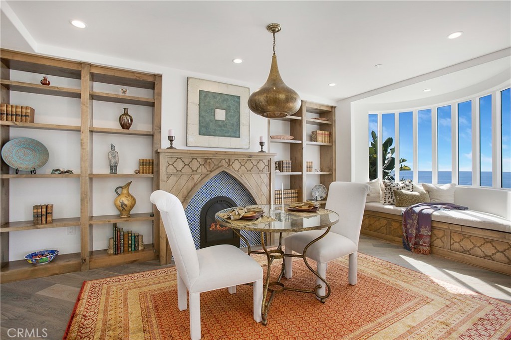 825 Coast View Drive Laguna Beach, CA 92651 - Photo 21 of 63 a view of a livingroom with furniture and a fireplace