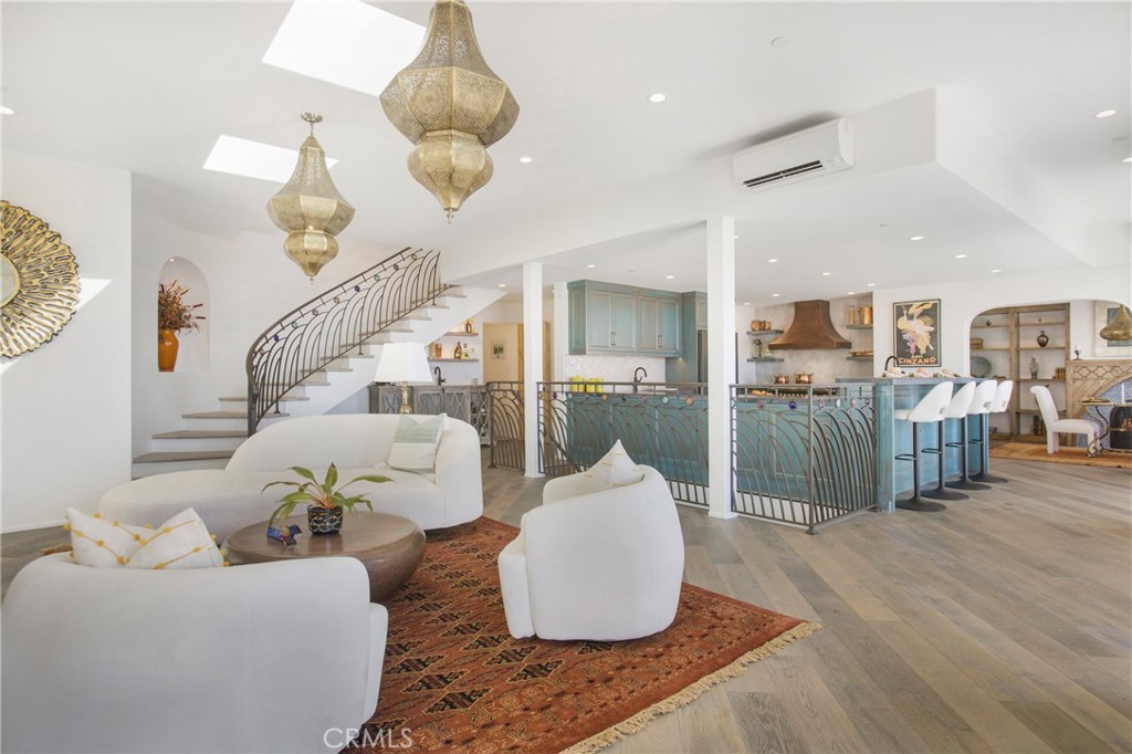825 Coast View Drive Laguna Beach, CA 92651 - Photo 4 of 63 a living room with furniture and wooden floor
