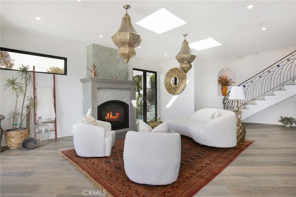 825 Coast View Drive Laguna Beach, CA 92651 - Photo 5 of 63 a living room with furniture and a fireplace