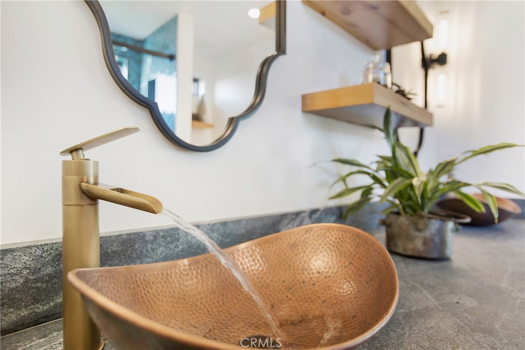 825 Coast View Drive Laguna Beach, CA 92651 - Photo 60 of 63 a vase of flowers sitting on a table