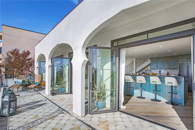 a living room with furniture a fireplace and a table