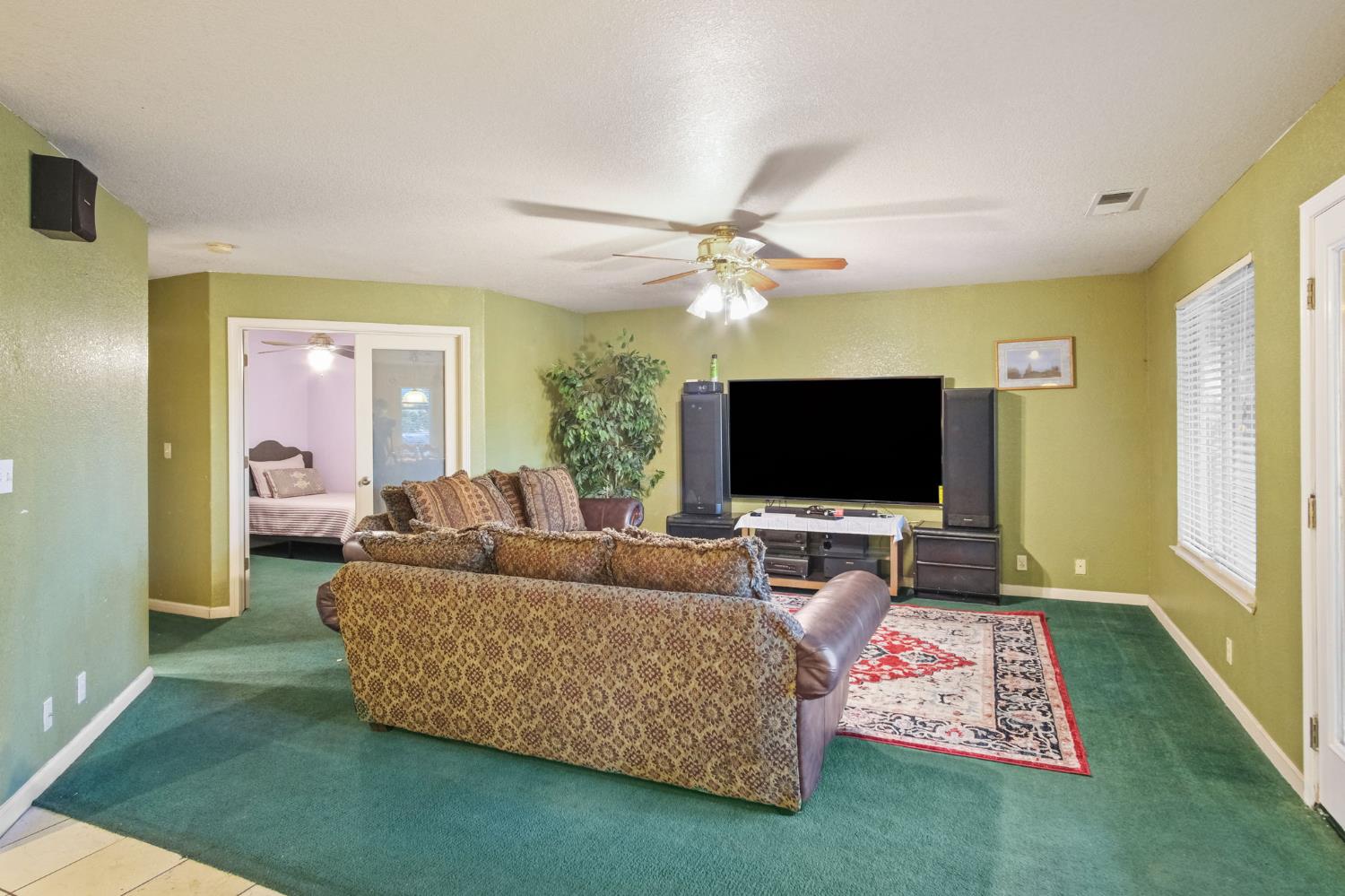 2805 Medinah Way Modesto, CA 95355 - Photo 16 of 39 a living room with furniture and a flat screen tv